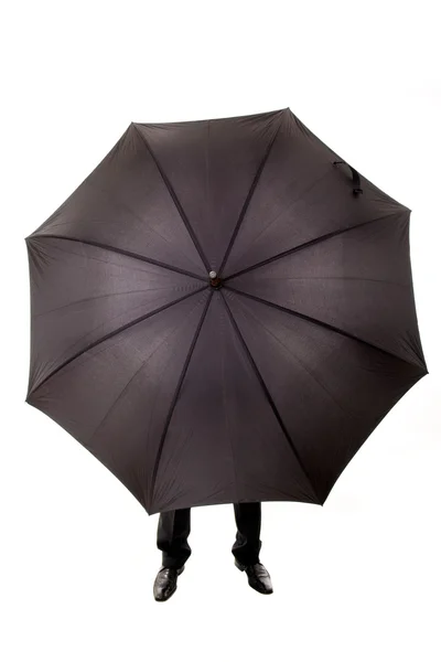 Homme d'affaires caché dans le parapluie — Photo