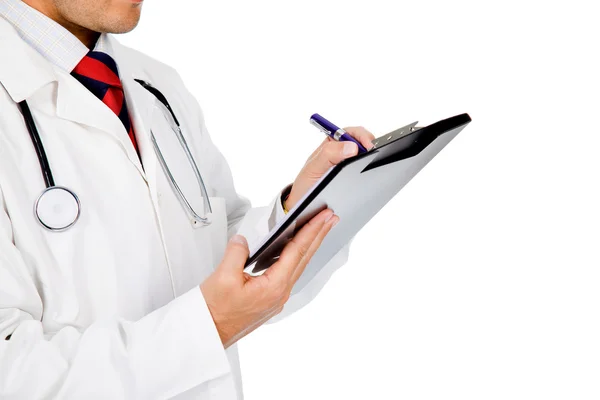Läkare med stetoskop skrivande — Stockfoto
