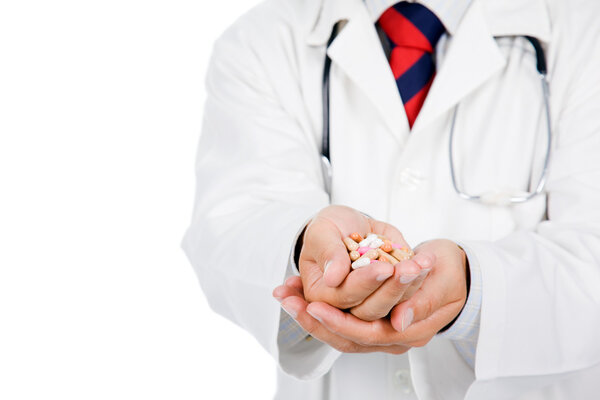 Doctor giving / showing medical pills