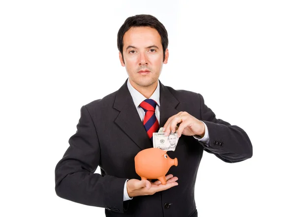 Empresário inserindo dinheiro em uma caixa de dinheiro porquinho — Fotografia de Stock