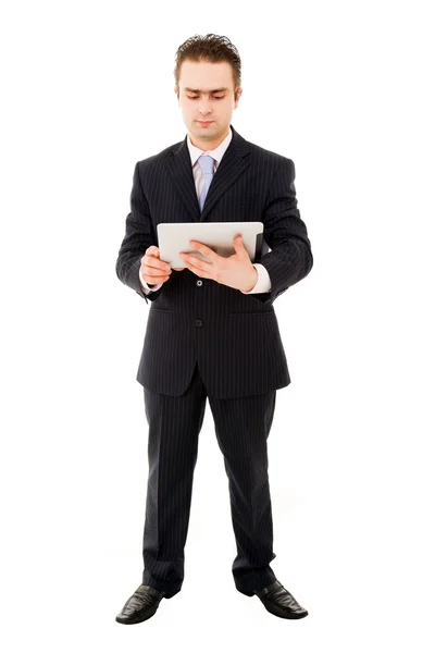 Jovem homem de negócios trabalhando com um tablet — Fotografia de Stock