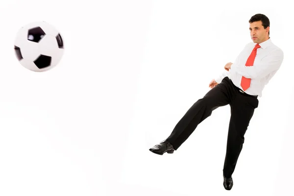 Young businessman playing soccer — Stock Photo, Image
