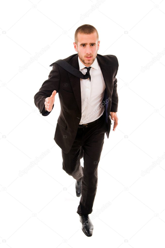 Young business man running isolated on white background