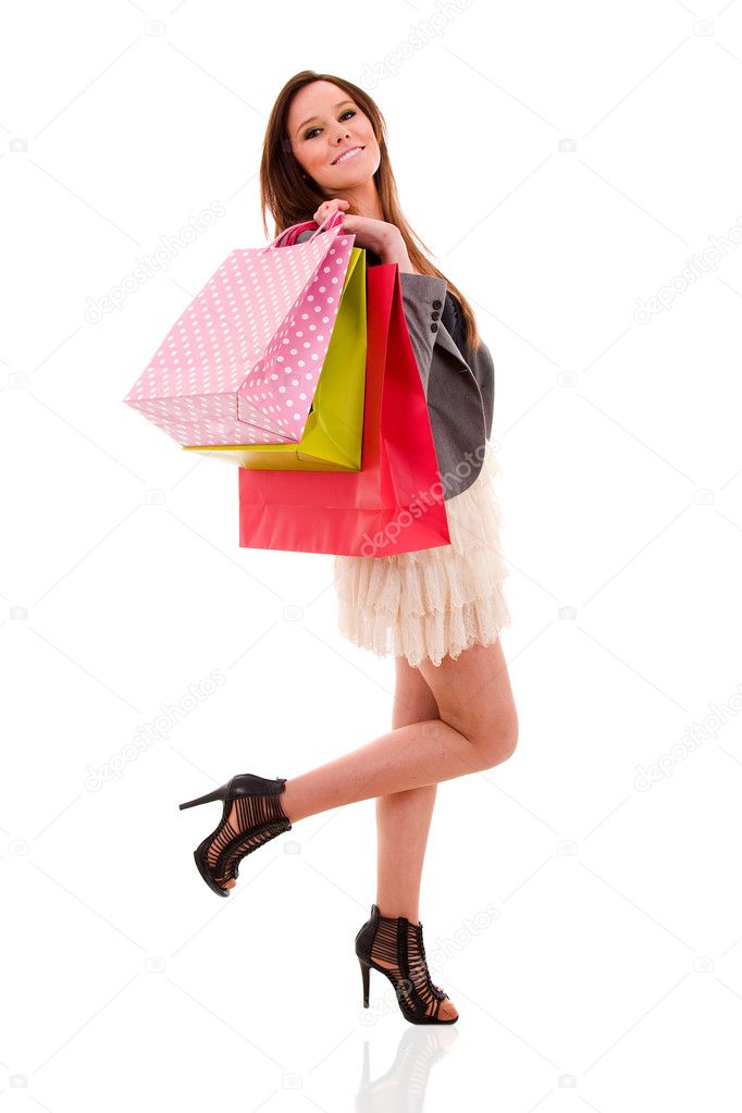 Lovely woman with shopping bags over white