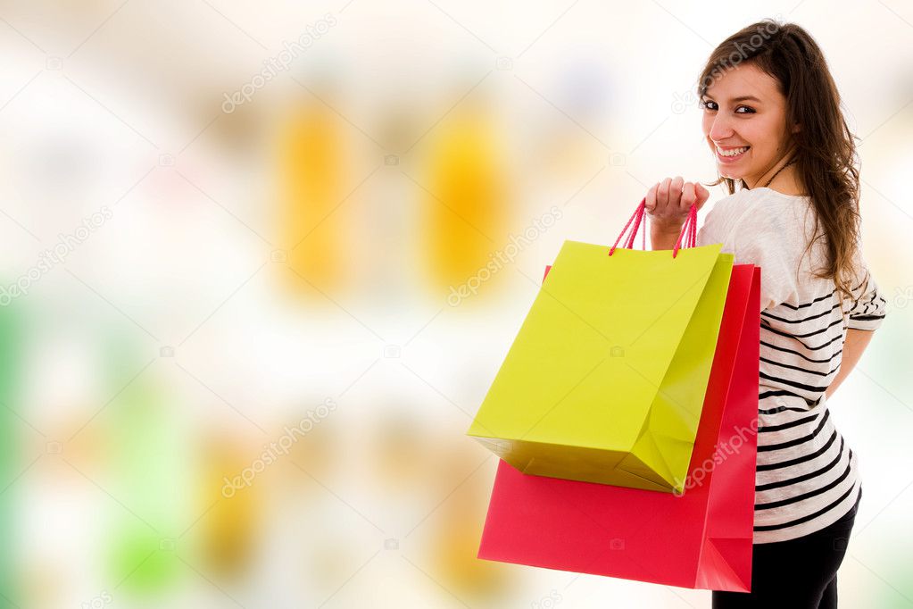 Young women with colored bags