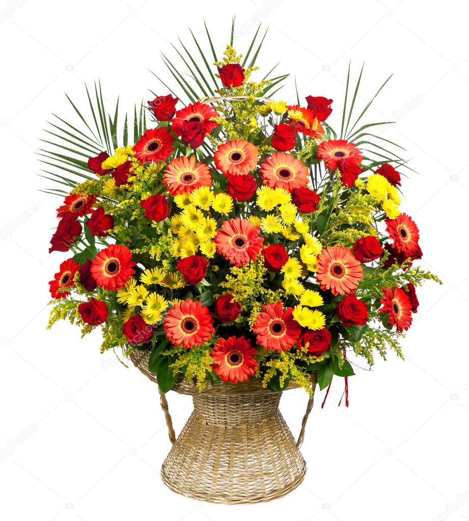 Basket of roses, gerberas and palm leaves