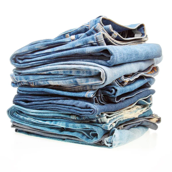 Pila di vestiti di denim blu Immagine Stock