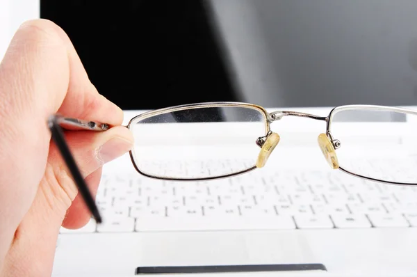 stock image Bad vision. Hand hold glasses