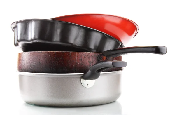 stock image Heap of frying pans. Isolated on white background