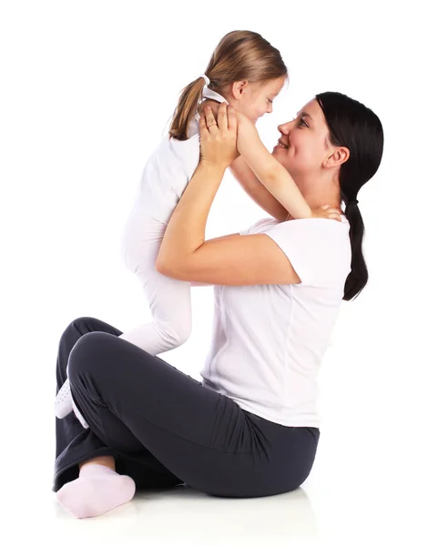 Adult beautiful mom holding small daughter. Isolated — Stock Photo, Image