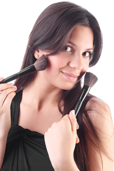 Beautiful young woman with a make-up brush. On white background — Stock Photo, Image