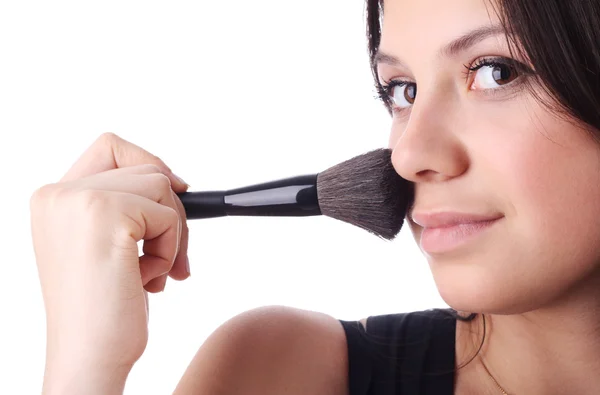 stock image Beautiful woman with a make-up brush. Isolated