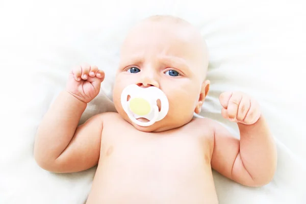 The baby sucks pacifier. Age - 3 months — Stock Photo, Image