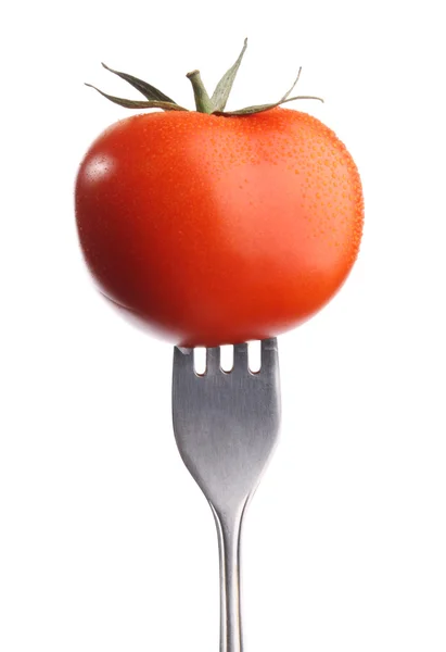 Tomato on fork, on whie background — Stock Photo, Image