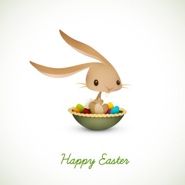 Easter Bunny Sitting in Bowl full of Colored Eggs clipart