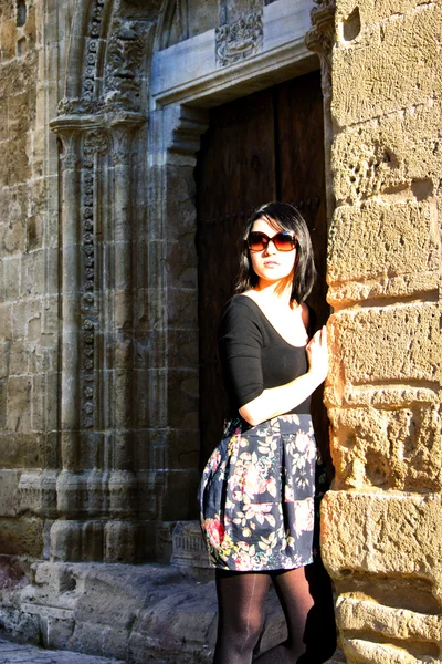 stock image Beautiful Young Girl Standing in front of a historical monument