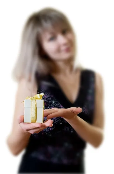 Beautiful young woman with gift — Stock Photo, Image
