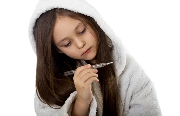 Girl looking at thermometer — Stock Photo, Image