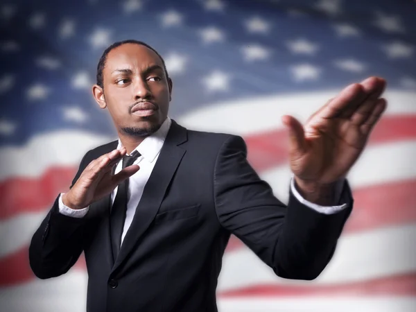 Young African American guy and a flag — Stock Photo, Image