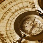 Old compass on ancient map Stock Photo by ©galdzer 5945057