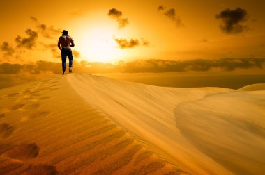 The man be ready to drop with weariness in desert. clipart