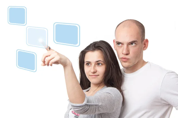 stock image Young couple selecting on a virtual touch interface