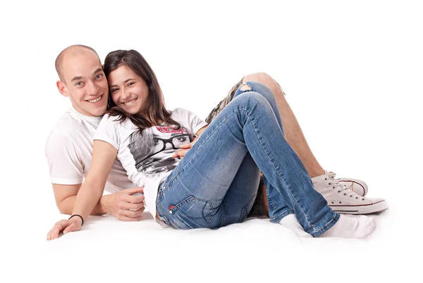 Szczęśliwa para na białym tle na podłodze — Zdjęcie stockowe