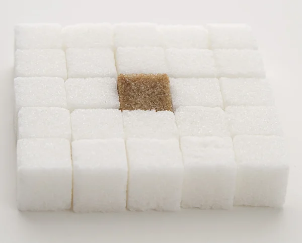 Vitt socker och en panna — Stockfoto