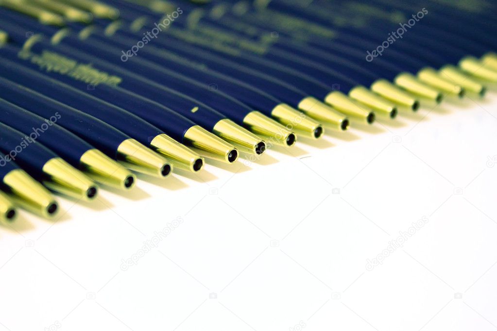 Line of pad printed pens on a white background