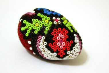 Traditional hand made Easter egg with beadwork on top clipart