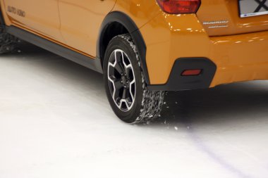 Wheel on ice of Subaru car clipart