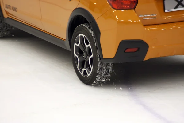 Wheel on ice of Subaru car — Stock Photo, Image