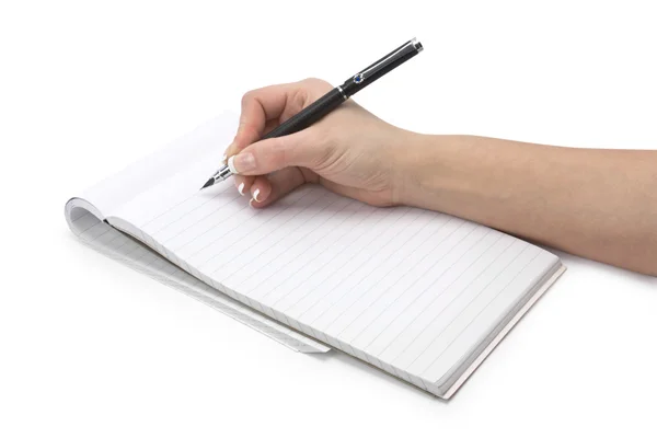 Writing hand in a notebook — Stock Photo, Image