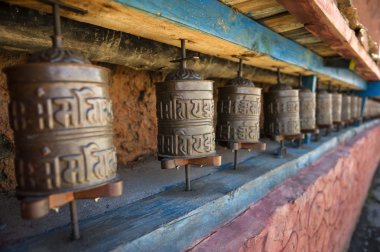 Prayer wheels in Nepal's Monastery. clipart