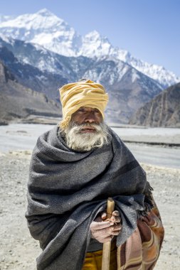 Buddhist pilgrim in Himalaya mountains clipart