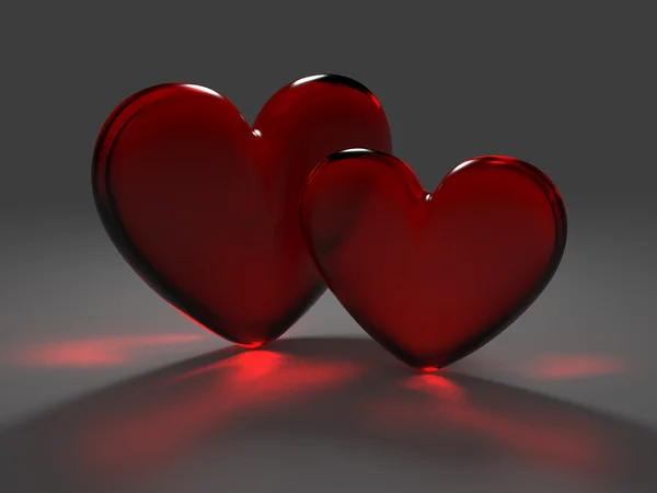 Two red hearts from frosted glass with caustic effect — Stock Photo, Image