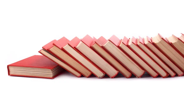 Купка червоних книг на білому тлі — стокове фото