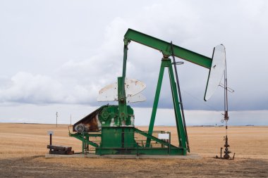 A pumpjack in Alberta, Canada. clipart