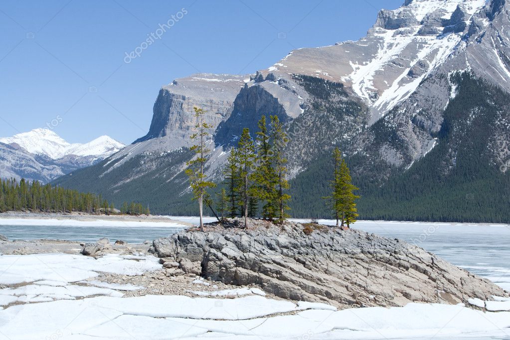 Winter landscape with Lake Minnewanka and Canadian Rocky Mountains