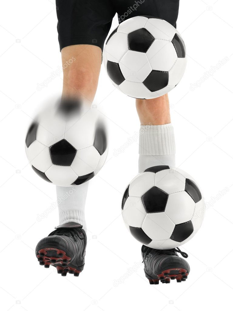 Juggling three soccer balls with the feet