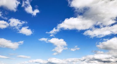 Sky background with fluffy clouds clipart