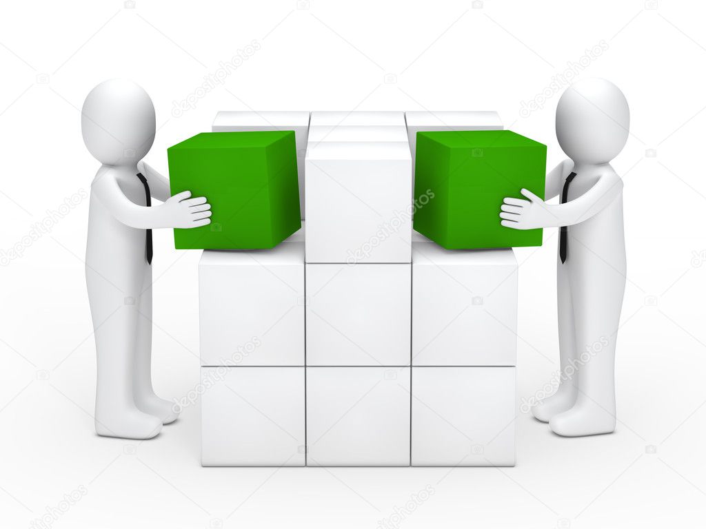 Businessmen stack green cubes