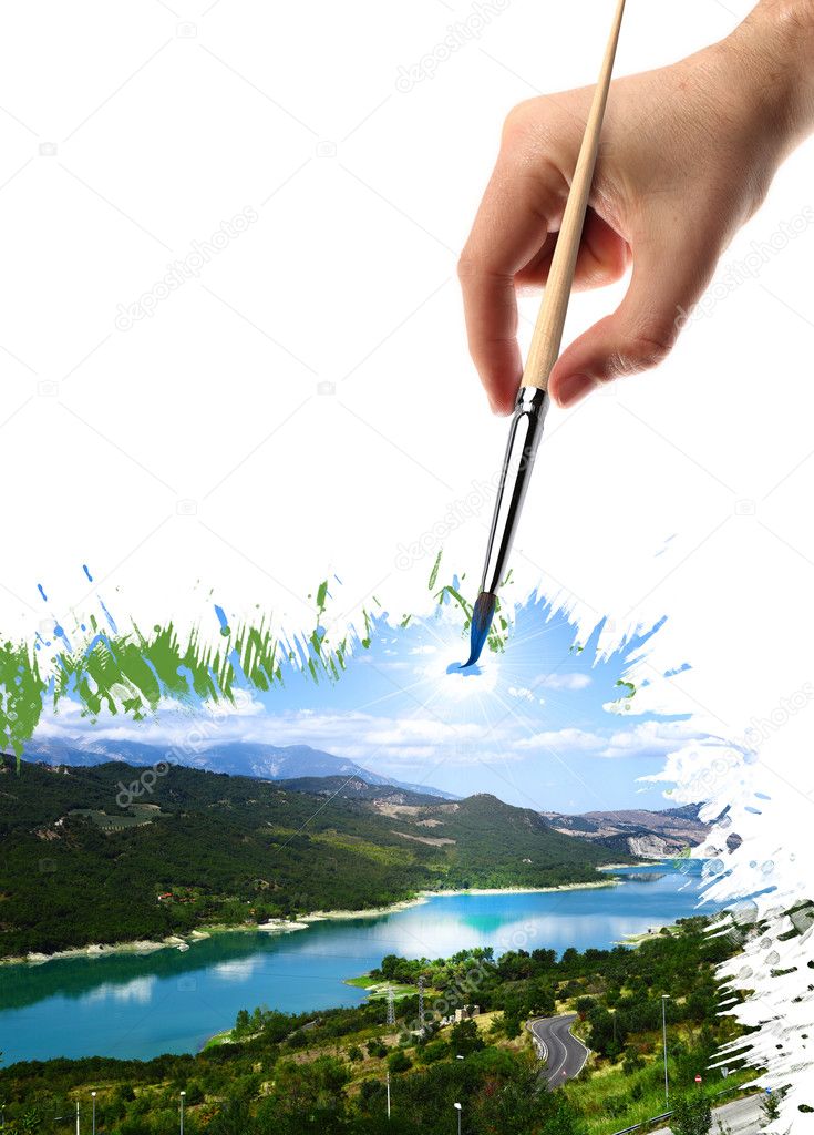 Hand that paints a landscape