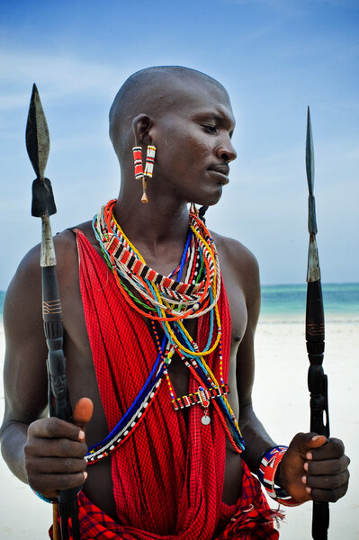 Maasai sitting by the ocean