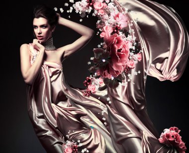 Attractive woman in beautiful fabric and flowers clipart