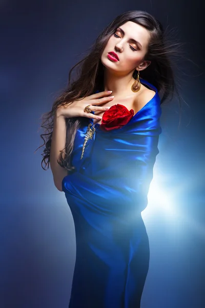 Art portrait of a beautiful woman in blue dress — Stock Photo, Image