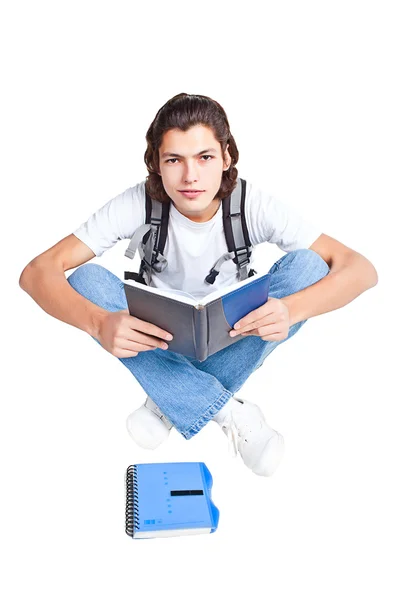 Estudante com um livro e uma mochila — Fotografia de Stock
