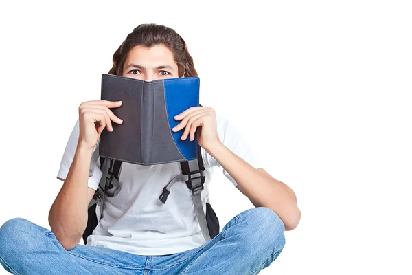 Estudante com um livro e uma mochila — Fotografia de Stock