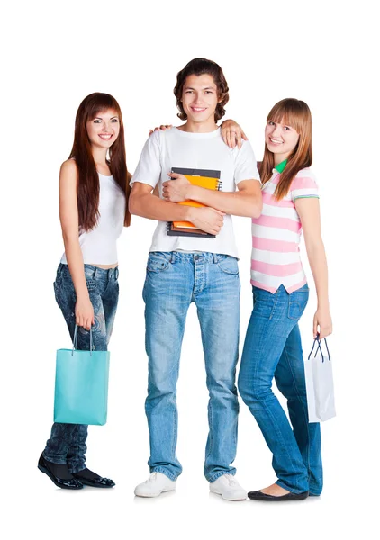 Elever stå med gul anteckningsbok och paket — Stockfoto