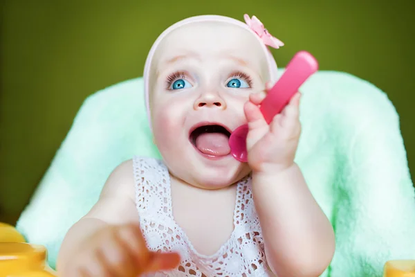 Cute kid with pink spoon — Stock Photo, Image